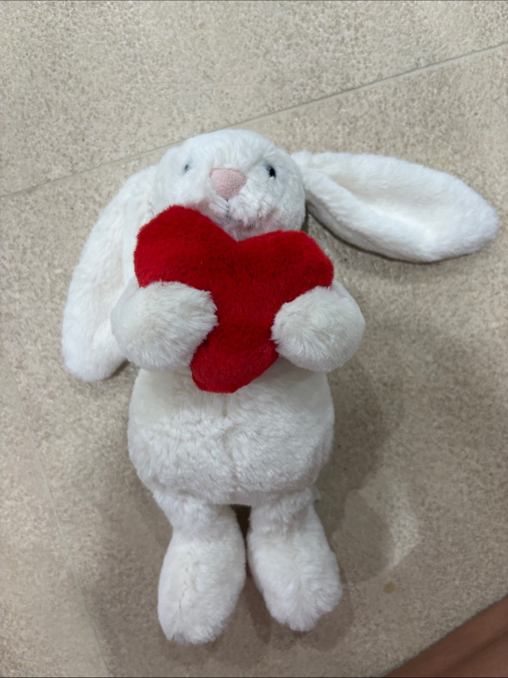 White jelly at bashful bunny holding heart